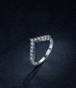 Detailed macro view of S925 sterling silver V-shape ring with sparkling pavé zircons