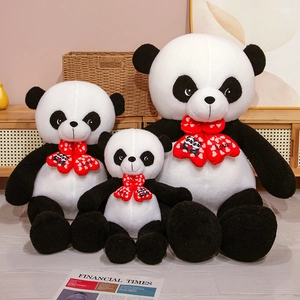 Three sizes of panda plush toys with red 'Love' bowties in a cozy home setting