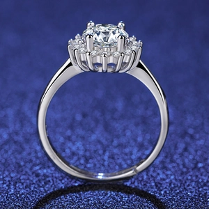 Detailed close-up of a silver adjustable ring featuring a round zircon in halo setting