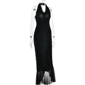 Detail of black halter dress featuring V-neckline, ruffled accents and irregular hemline