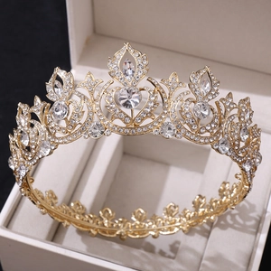 Macro shot of gold bridal crown with vintage rhinestones in a luxury jewelry box