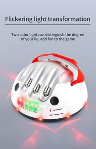 Detail view of electronic polygraph toy showing palm contact and mode buttons