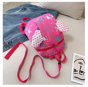 Detail view of pink kids backpack with bunny cloud prints and cute dotted ears