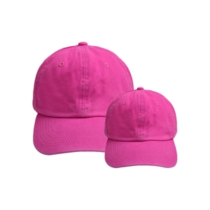 Detailed view of neon pink parent-child baseball cap set in washed cotton with stitching