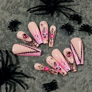 Pink and black Halloween press-on nails with spider web, heart and pumpkin designs