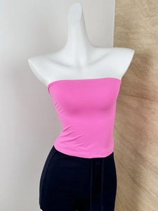 Close-up of a bright pink strapless tube top on mannequin with elastic knit fabric detail