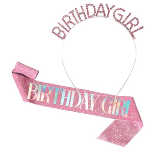Detail of pink glitter BIRTHDAY GIRL headband and matching holographic sash for party