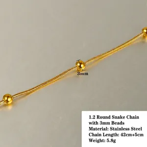 Macro shot of 18k gold plated 1.2mm snake chain with three 3mm beads in stainless steel