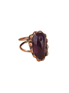 Vintage copper ring with irregular raw purple amethyst stone in punk aesthetic