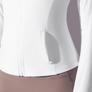 Detail of side zipper pocket and smooth stitching on white nylon hooded sports jacket