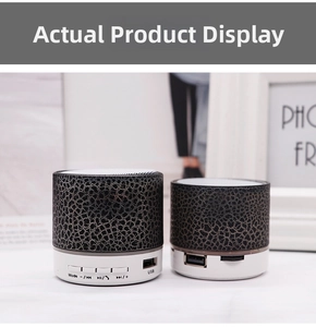 Detail view of mini crackle Bluetooth speaker with USB port and LED control buttons