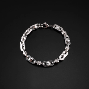 Polished silver stainless steel bracelet featuring unique spherical and rectangular links