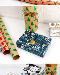Detail of Christmas themed wrapping paper rolls and gift boxes with reindeer patterns