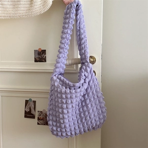 Detail of light purple popcorn fabric texture on a large capacity commuter tote bag
