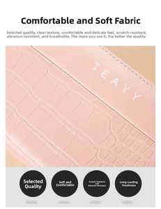 Close-up of pink long wallet showing faux crocodile texture and soft leather finish
