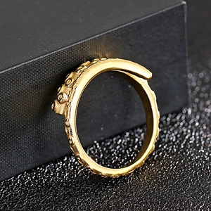 Vintage gold octopus tentacle ring in punk rock style with textured suction cup details