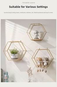 Macro detail of geometric hexagonal wall shelves with gold metal frame and wood base