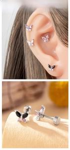 Macro shot of butterfly stud earrings with marquise-cut gems and flat screw-back pins