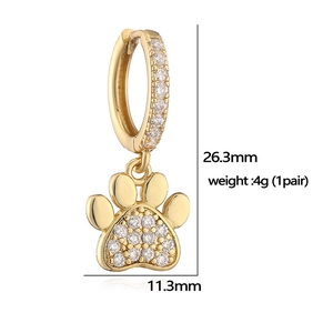 Detail view of gold cat paw earrings with clear zircon pavé stones and size dimensions