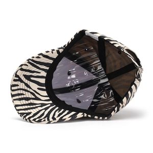 Detail view of the zebra print baseball cap featuring internal mesh lining and sweatband