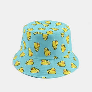 Light blue reversible bucket hat with cute all-over yellow duck pattern for sun protection