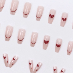 French ballet style press-on nails with red hearts and minimalist lines on nude base