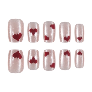 Short square pink cat eye press-on nails with glitter and red heart patterns