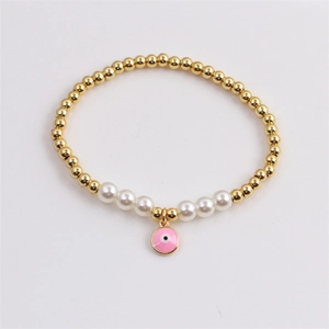 Bracelet à perles dorées avec perles blanches et pendentif Œil grec rose pour femme