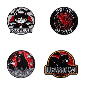 Detailed close-up of four dark parody cat enamel pins featuring movie character designs