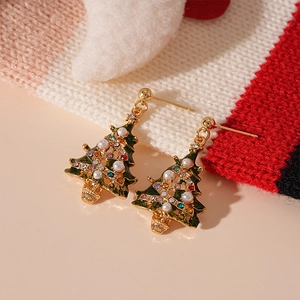Detailed view of gold-plated Christmas tree earrings with green enamel and colored crystals