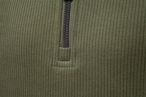 Detail of army green ribbed knit sweatshirt featuring a premium half-zip metal closure