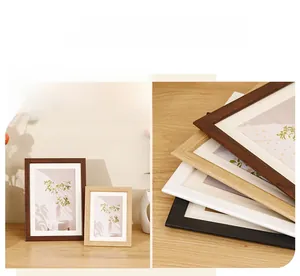 Stack of minimalist wood and black frames with white mat for wall or tabletop display
