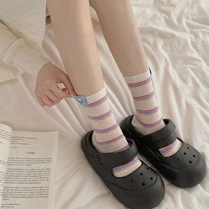 Colorful striped crew socks for women featuring blue cartoon puppy label and cotton mesh