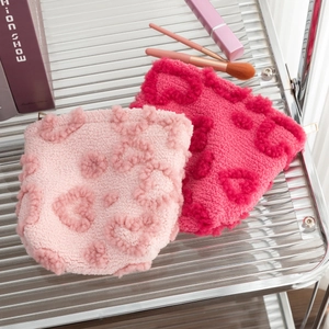 Plush heart-embossed storage bag with zipper for makeup and travel accessories