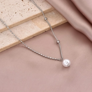 Elegant silver stainless steel necklace featuring a pearl pendant and beaded chain design