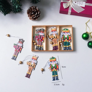 Set of 3 painted wooden nutcracker soldier ornaments in a storage box for Christmas decor