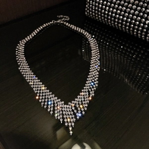 Silver fringe V-shaped tassel necklace in titanium steel with sparkling white rhinestones