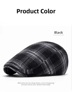 Detailed close-up of a vintage black and gray plaid flat cap in British newsboy style