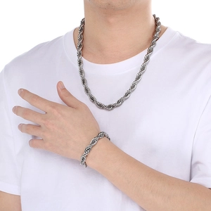 Silver 10mm stainless steel twist chain necklace and bracelet set on male model