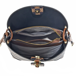 Minimalist bucket bag with large capacity featuring interior compartments and gold hardware