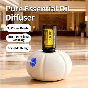 Waterless essential oil diffuser with pumpkin design showing mist and LED indicator