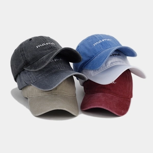 Close-up of assorted vintage washed cotton baseball caps with mama embroidery detail