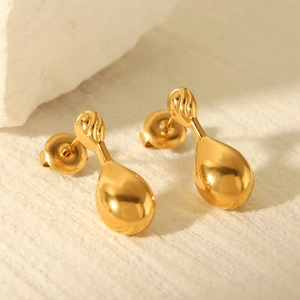 Polished 18k gold plated stainless steel teardrop earrings on natural stone background