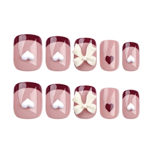 Pink french press-on nails with red heart patterns and 3D white bows set of 10