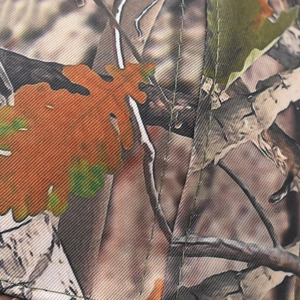 Detail of leaf camouflage baseball cap with durable twill texture and green double stitching
