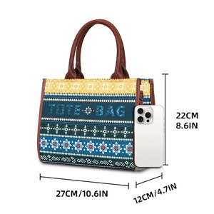 Ethnic pattern tote bag in blue and yellow with dimensions 27x22x12cm shown with phone scale