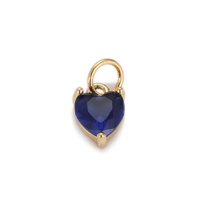 Detail of heart-shaped dark blue zircon pendant with gold-plated setting and top loop