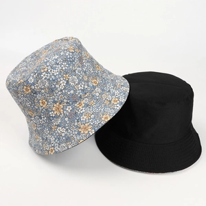 Close-up of reversible bucket hat stitching detail with floral and black fabric layers