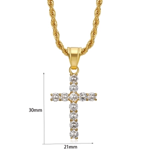 Detail view of 30mm gold cross pendant with cubic zirconia and twisted rope chain