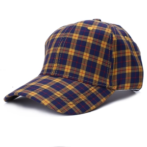 Close-up detail of unisex plaid cotton baseball cap with classic British pattern